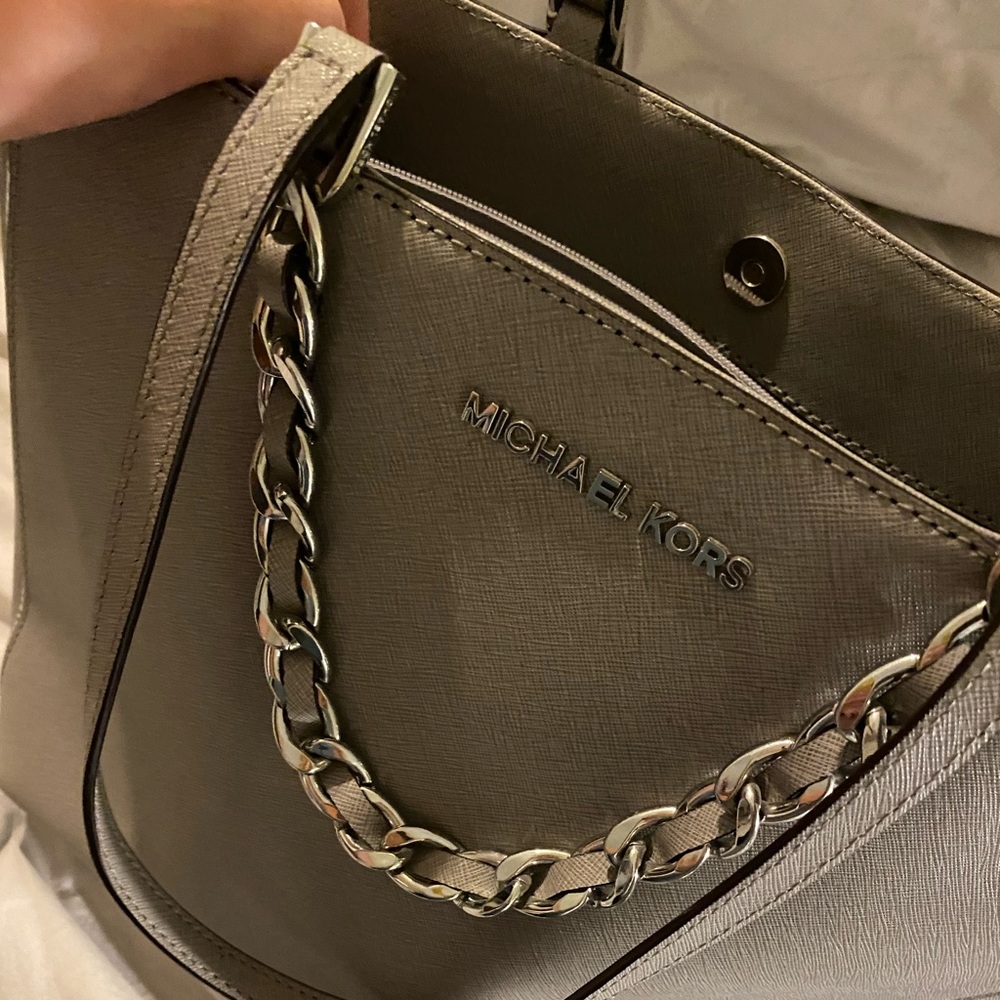 Large like new gray with sliver hardware bag.